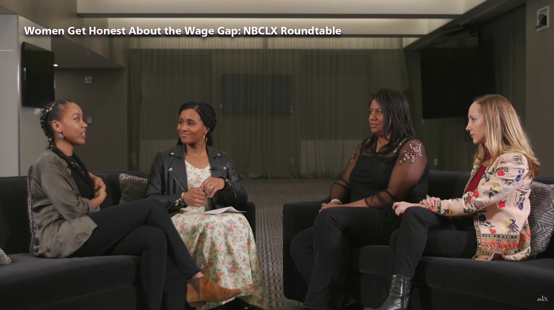 Four women sitting on a staged set