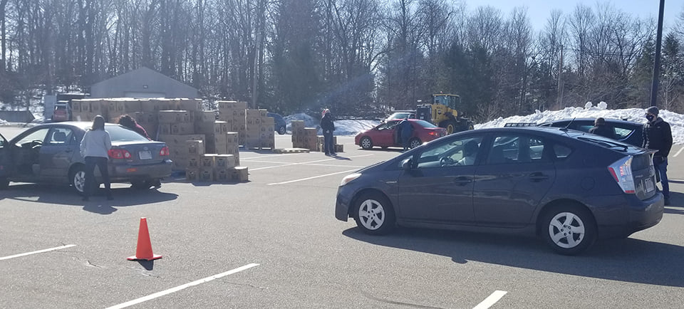 cars lined up to receive food boxes