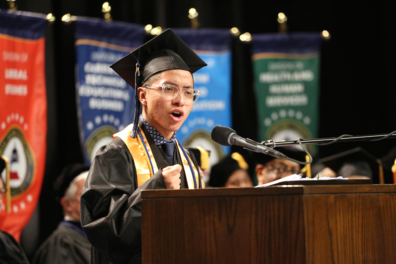 Photo of Alex Roblero at the podium