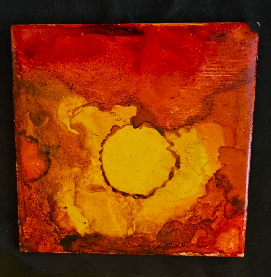 red and orange art produced by alcohol inks