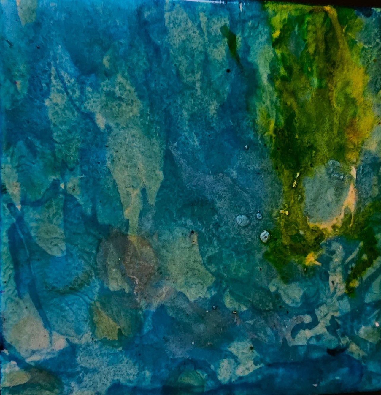blue and green art created by alcohol inks