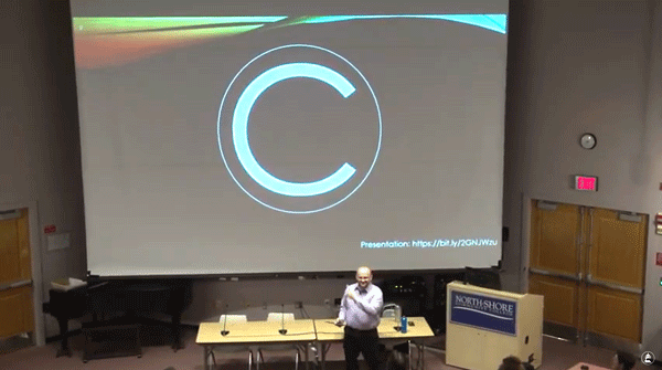 freee frame of lecture with Big copyright symbol on screen