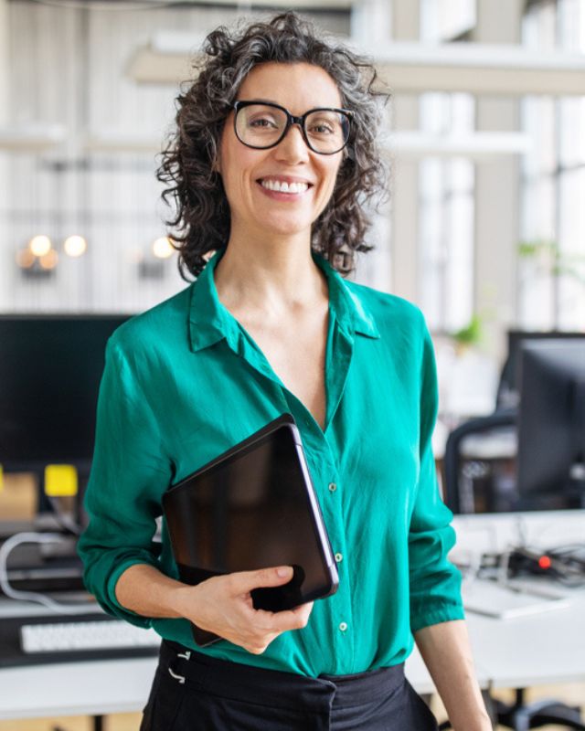 Human Resources professional smiling in office setting