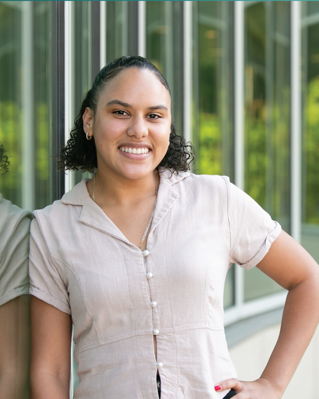 Portrait of NSCC Student Maria Maria Rosario standing against window of Danvers Health Professions Building