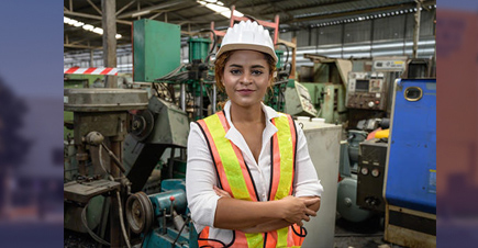 female in hard hat in manufacturing setting