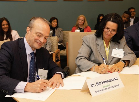 bill heineman, deb ruggierio signing documents