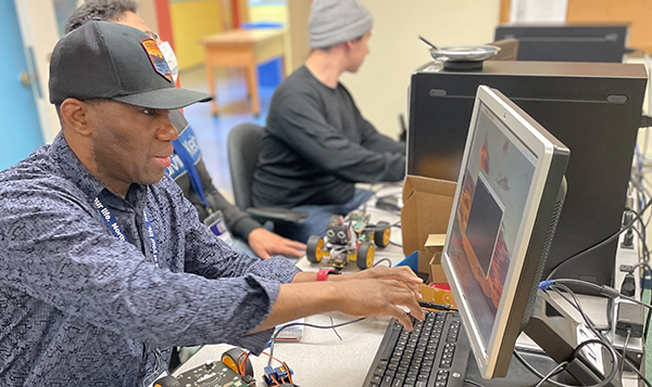 two men at computers