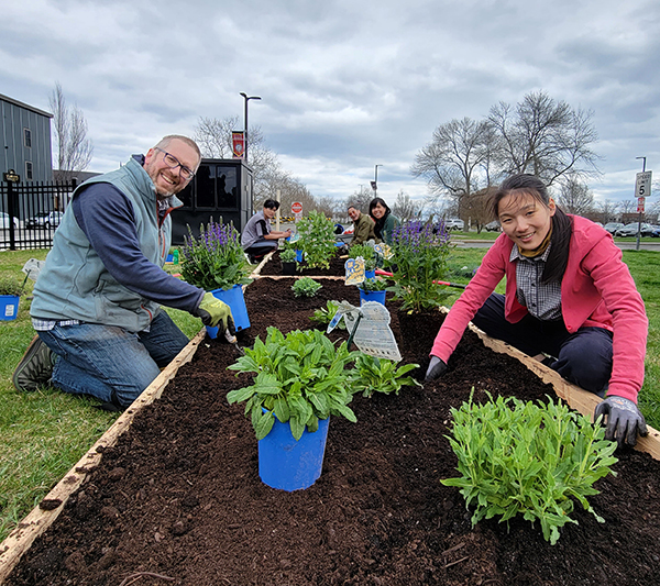 people planting pollinators