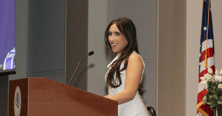Sam Hartman delivering her speech at graduation at UMass Boston