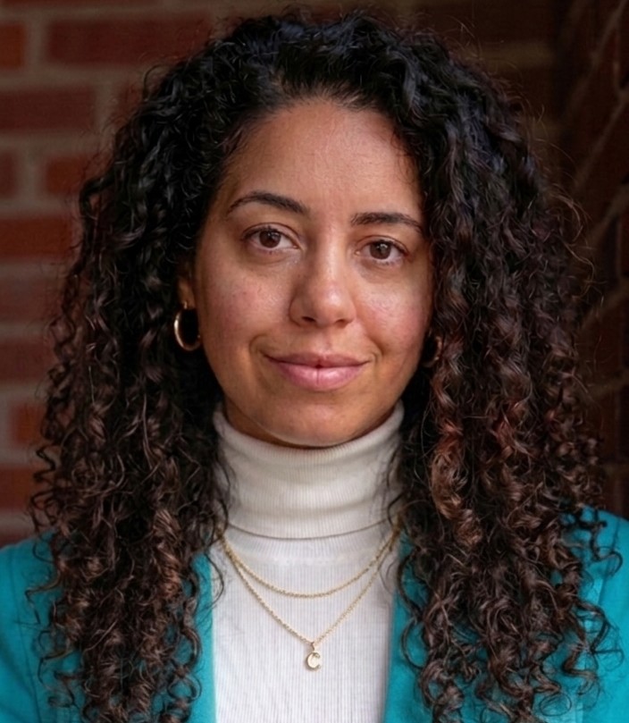 A headshot of Clarissa Summons