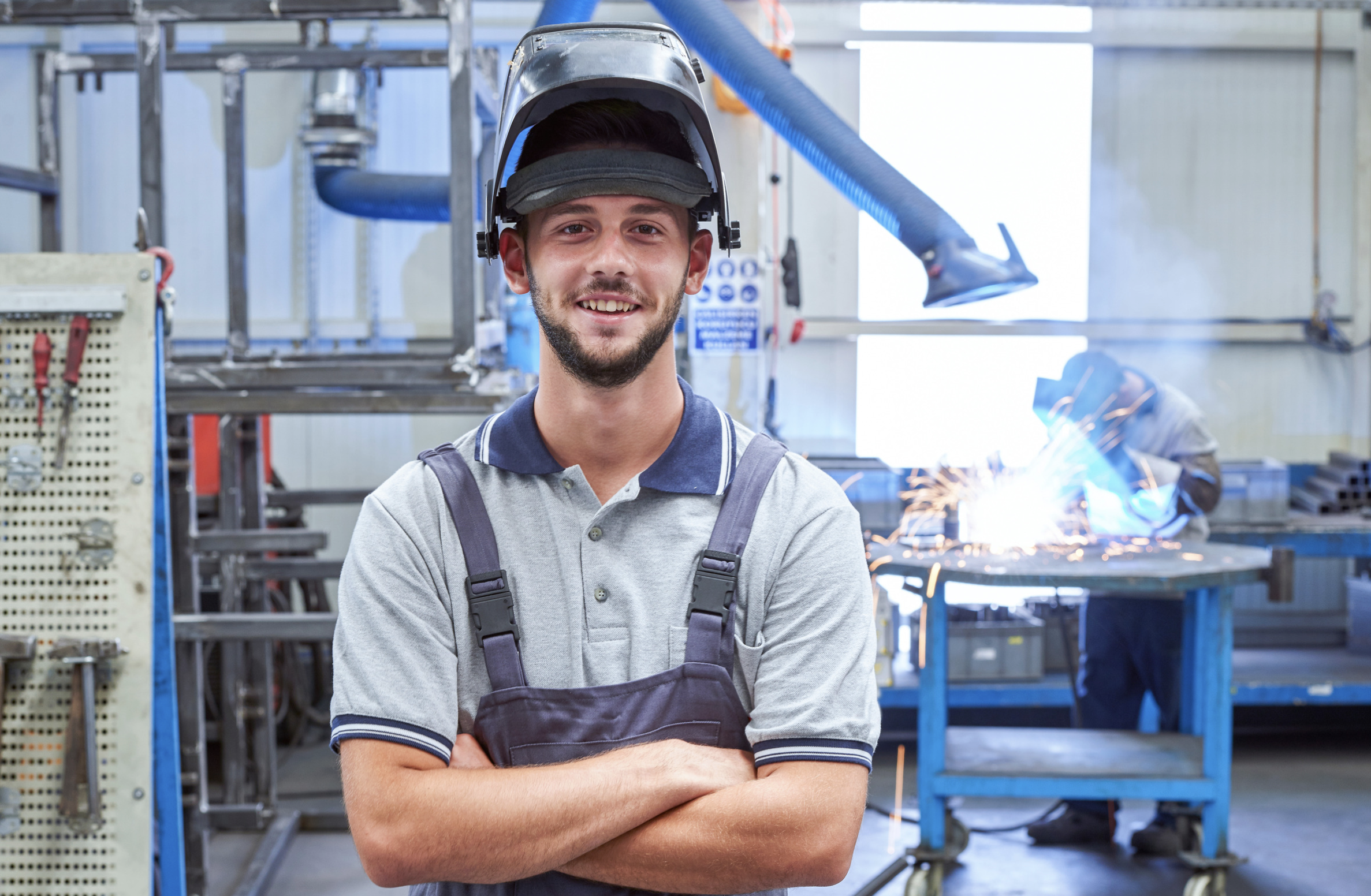 portrait of manufacturing worker smiling at the camera