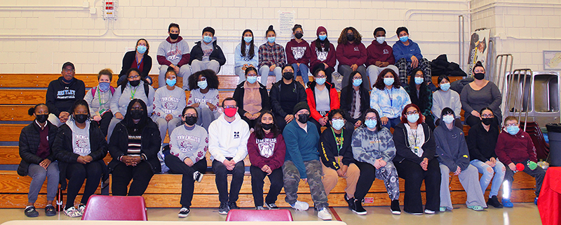 Group of TRIO students in Lynn gym bleachers